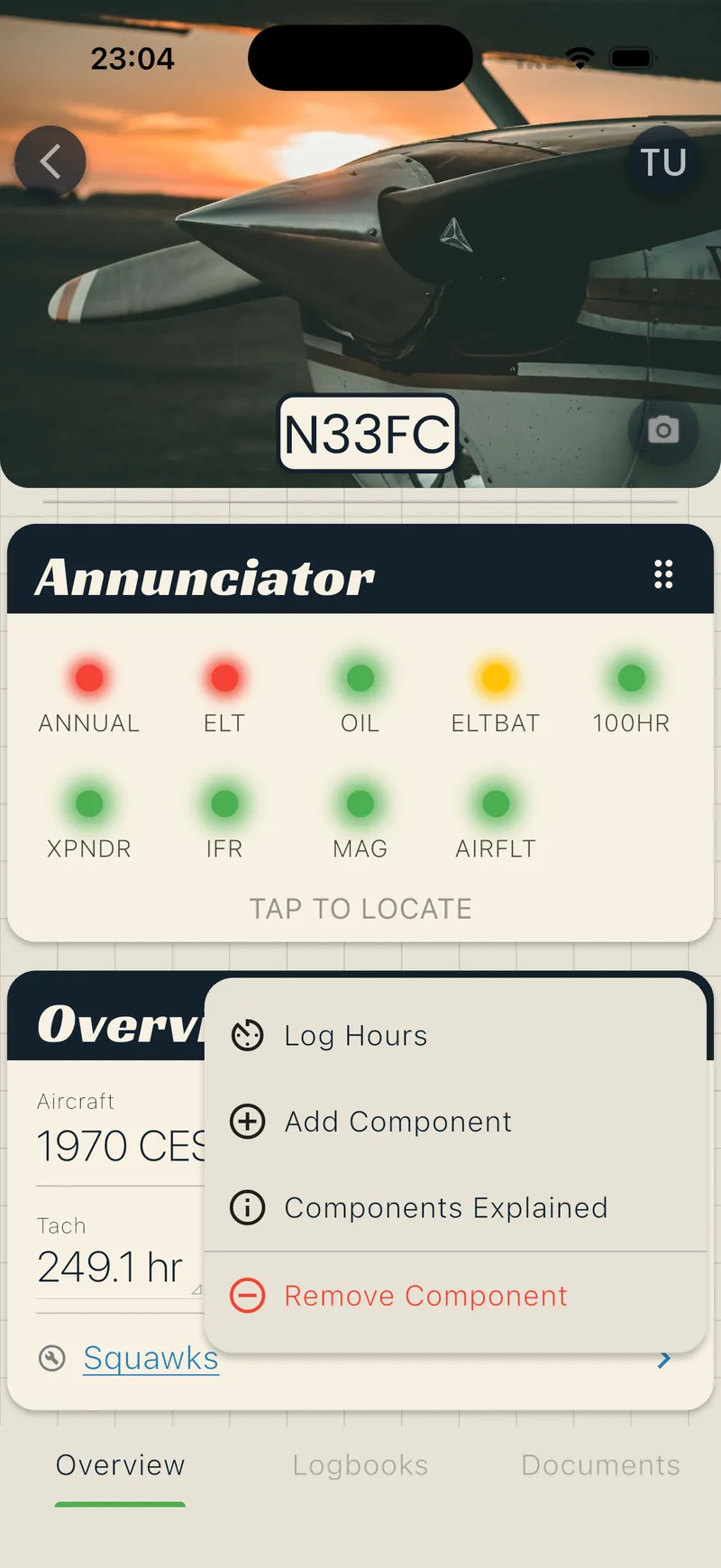 Aircraft overview with three-dot menu open showing Log Hours